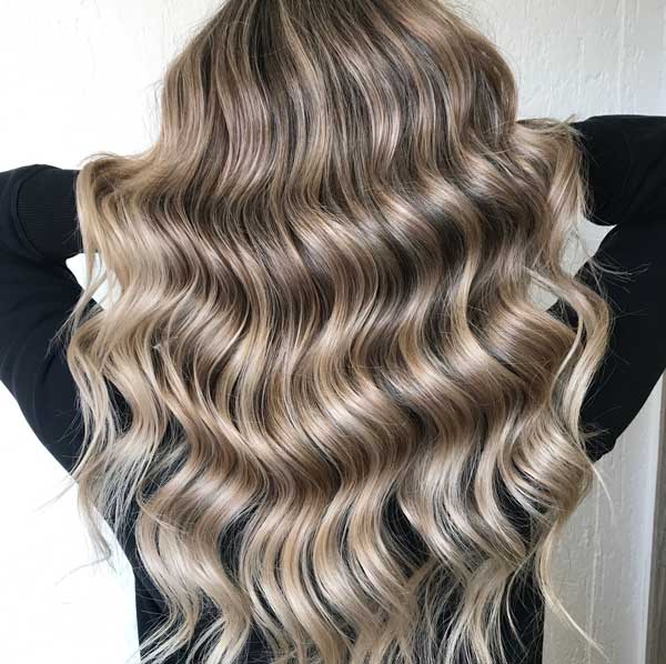 The highlights and lowlights are perfect for fall - contact Cutting Crew Hair Salon today!